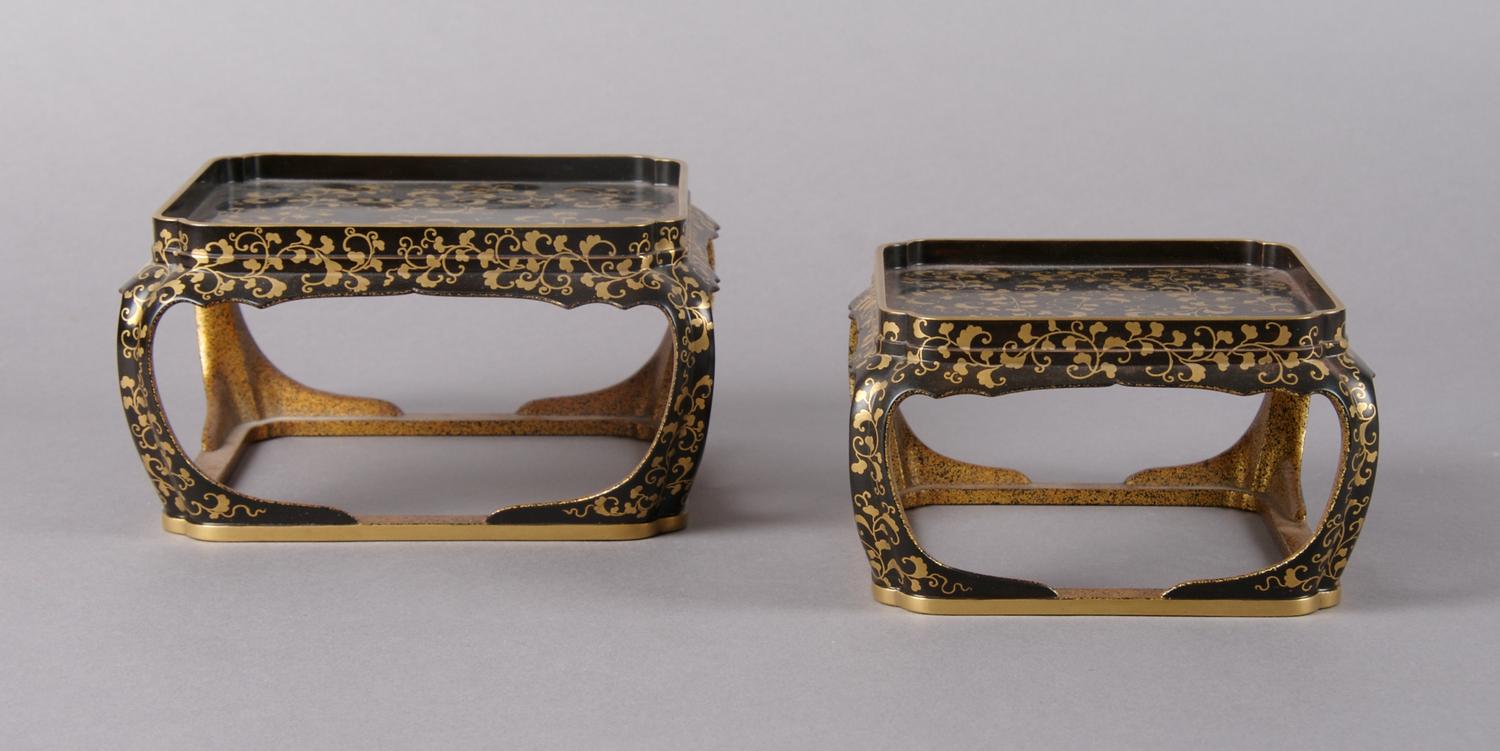 A Pair of Conforming Japanese Lacquer and Gilt Stands, Height of tallest 3 1/2 x width 6 1/2 inches.