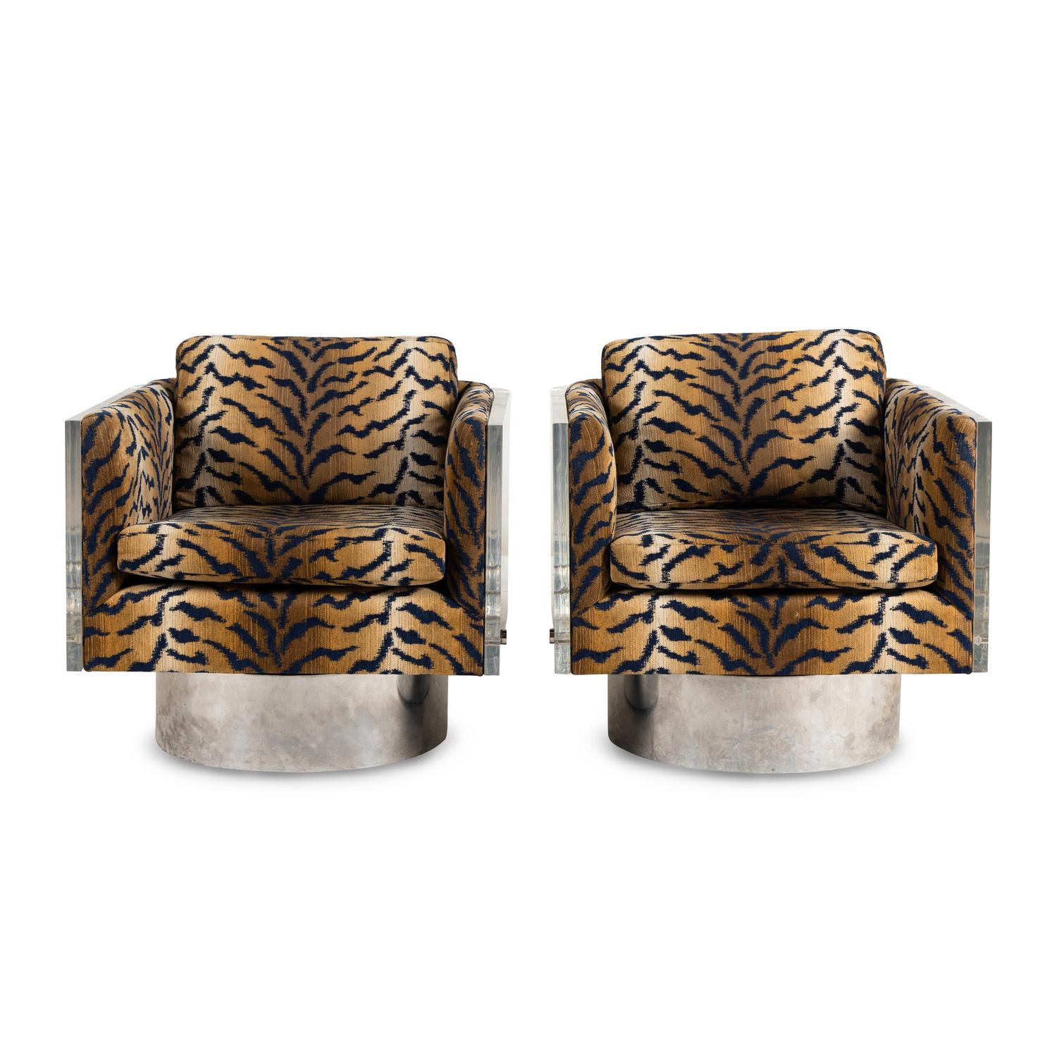 A Pair of Acrylic Swiveling Armchairs