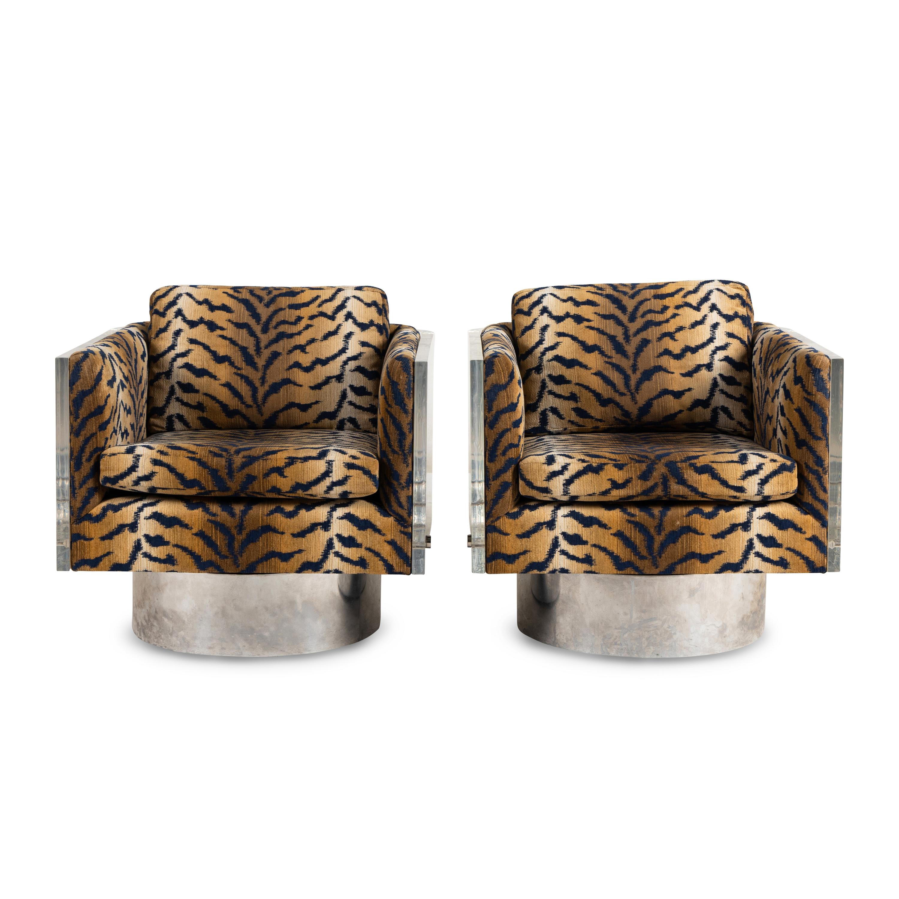 A Pair of Acrylic Swiveling Armchairs