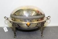 An American Silver-Plate Bacon Warmer. Height 8 1/4 x length 13 1/2 x width 8 inches.
