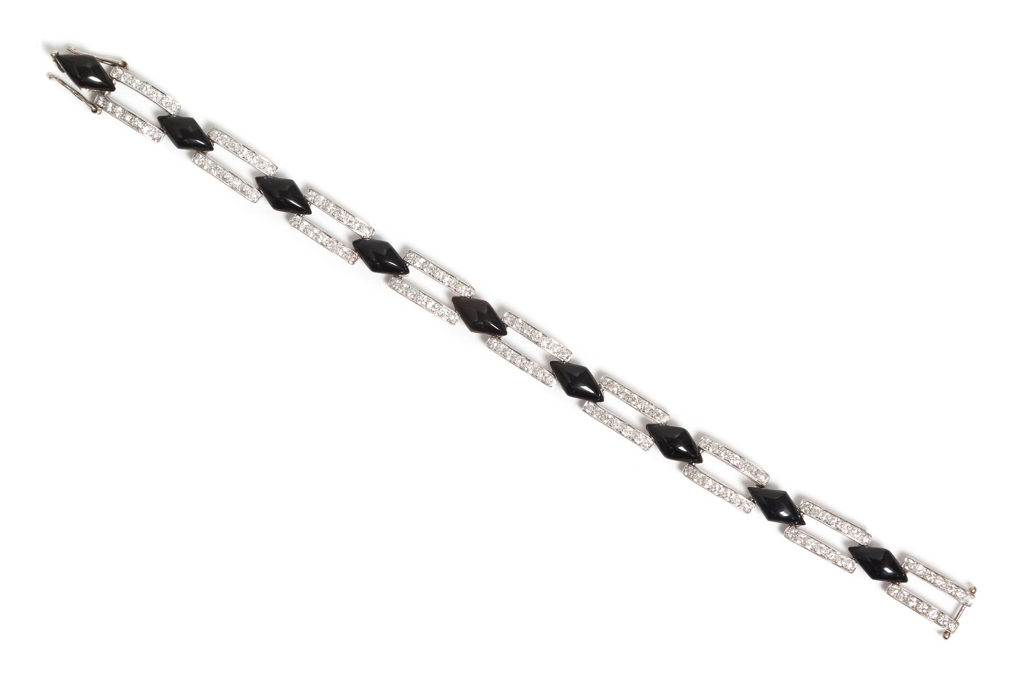 A White Gold, Diamond and Onyx Bracelet, 10.50 dwts.