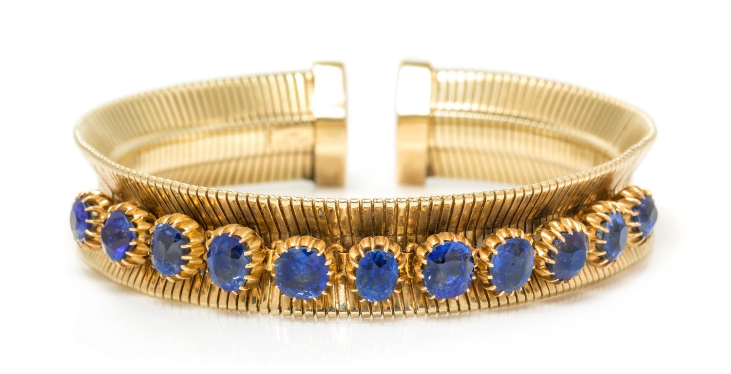 A Retro Yellow Gold and Sapphire Cuff Bracelet, Forstner, 23.90 dwts.