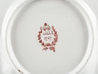 A Pair of French Faience Shield Form Plates