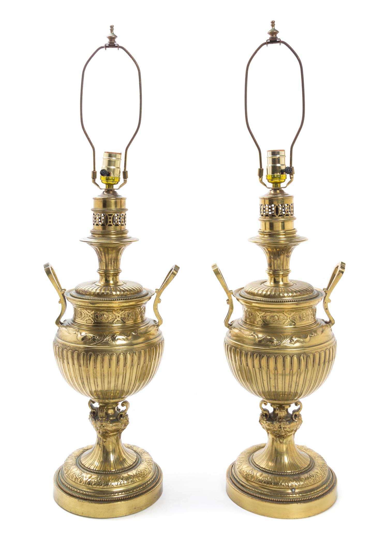 A Pair of Brass Fluid Lamps Height 21 inches.