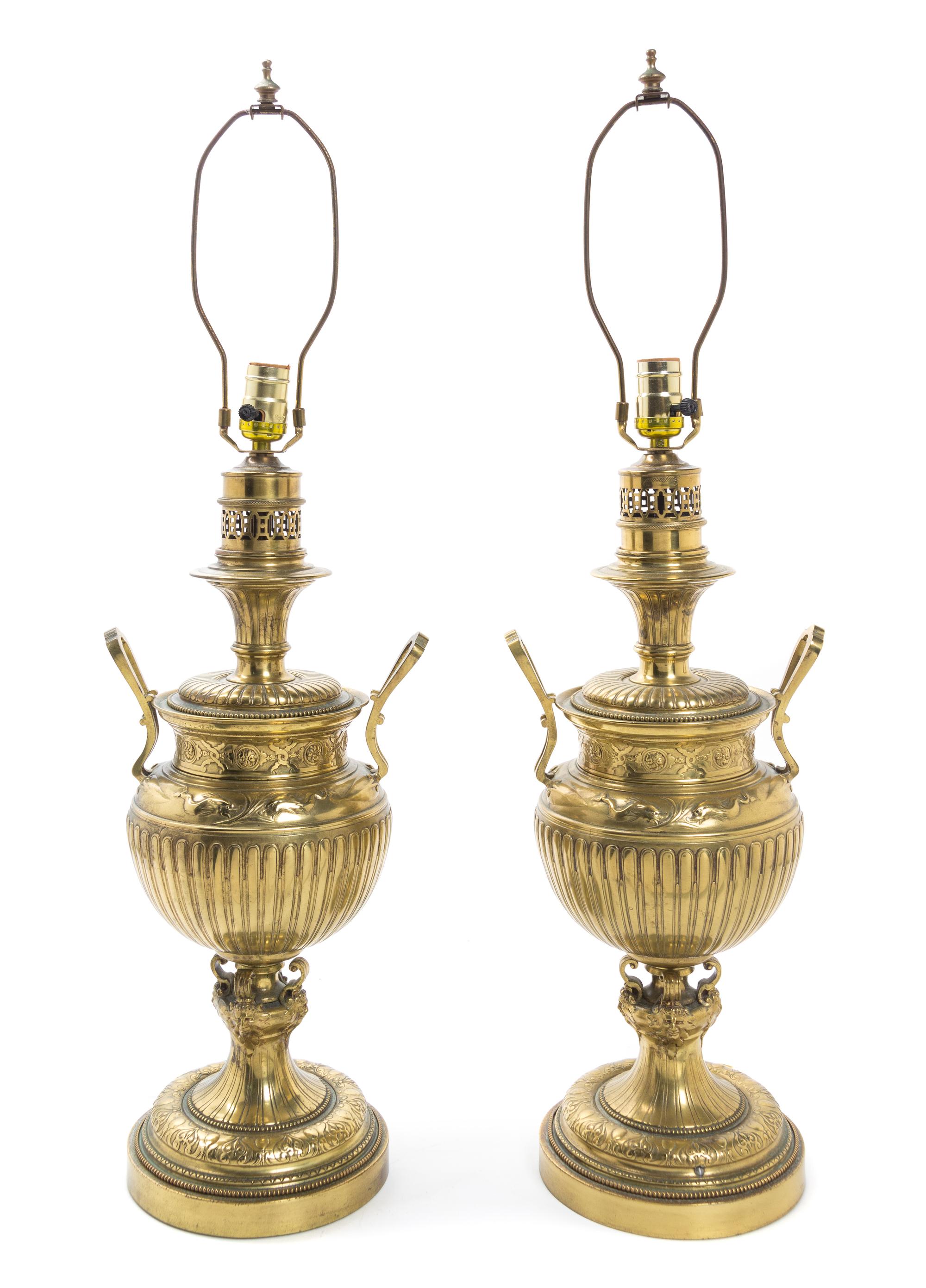 A Pair of Brass Fluid Lamps Height 21 inches.
