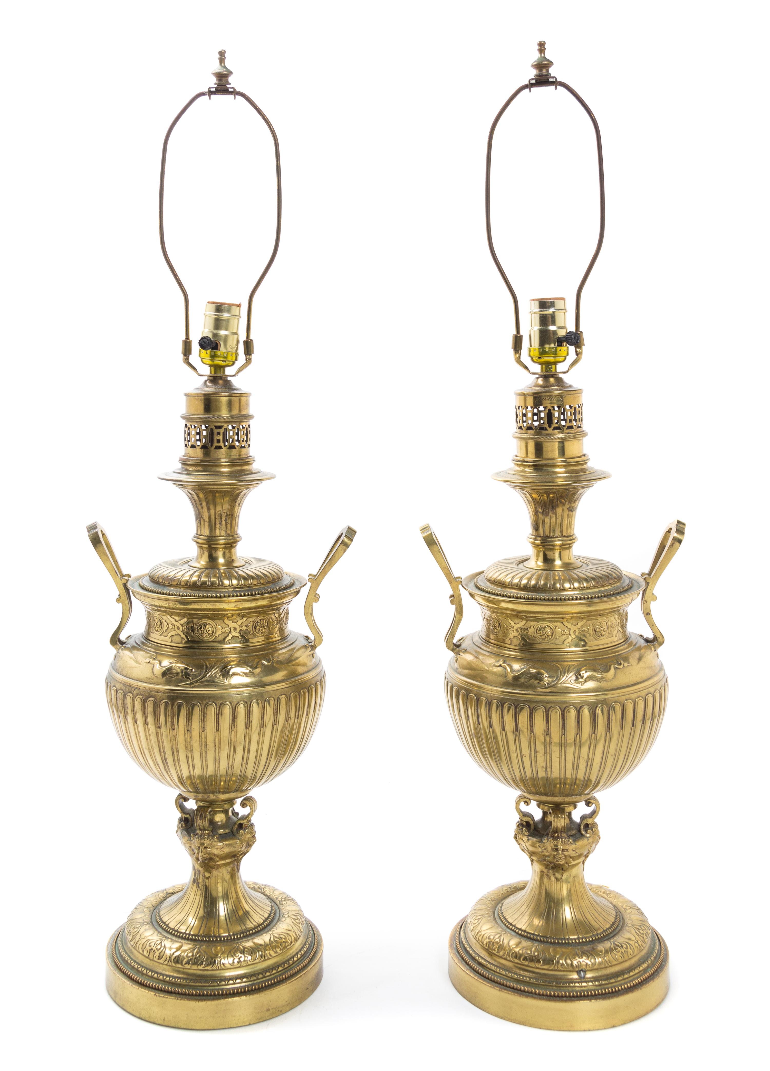 A Pair of Brass Fluid Lamps Height 21 inches.