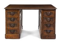 A Renaissance Revival Carved Oak Pedestal Desk, Height 29 1/2 x width 49 3/4 x depth 32 inches.