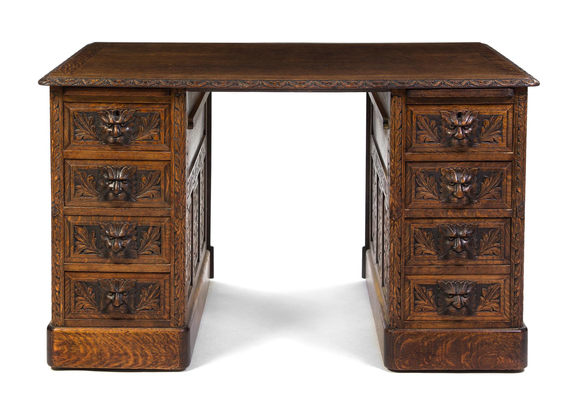 A Renaissance Revival Carved Oak Pedestal Desk, Height 29 1/2 x width 49 3/4 x depth 32 inches.