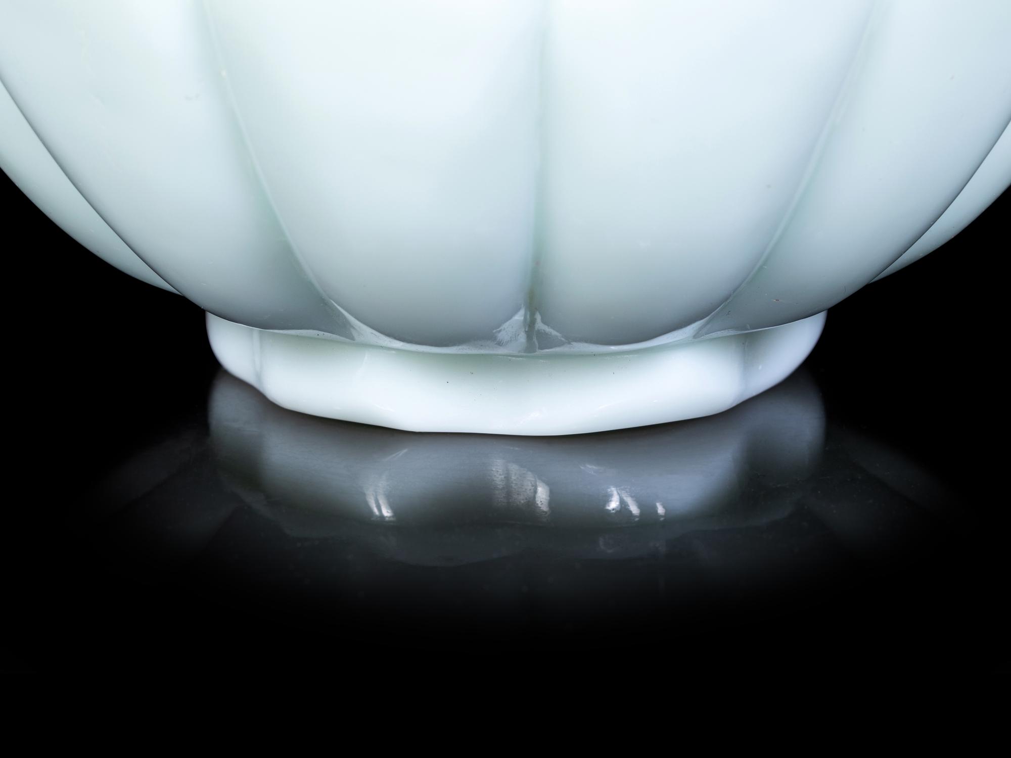 A Pair of Chinese Celadon Glass 'Lotus' Bowls