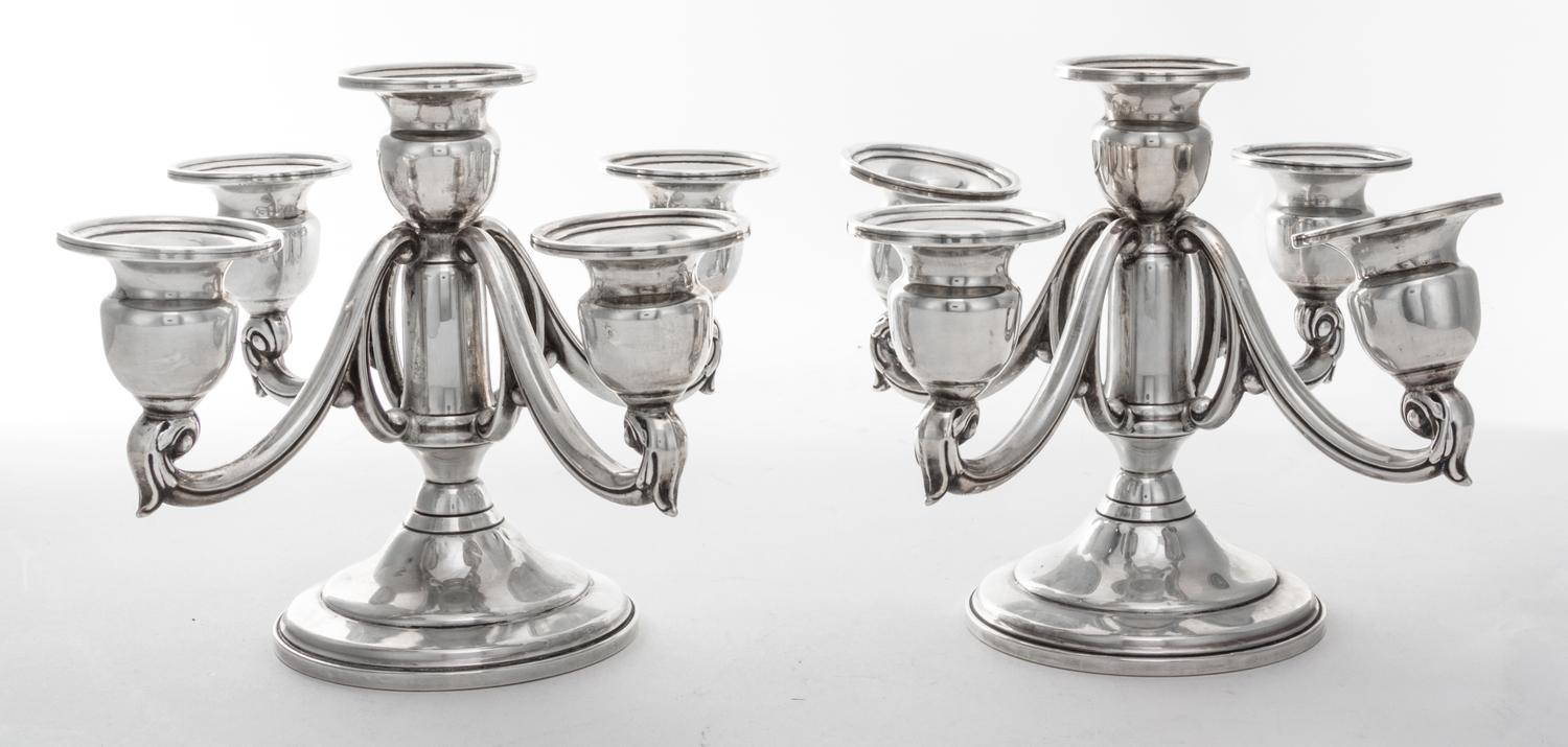 A Pair of American Silver Five-Light Candelabra, Mueck-Carey Co., New York, NY, having a trumpet form base, the cups of baluster form,