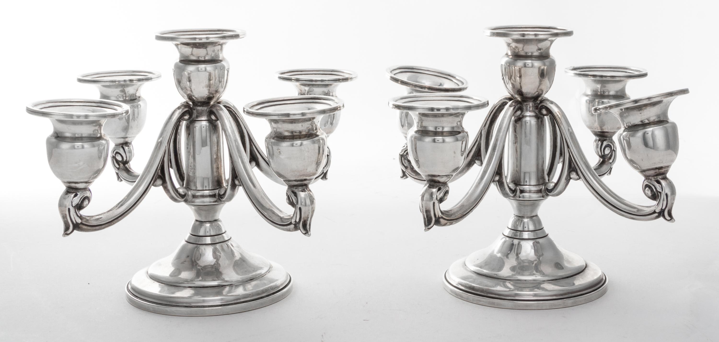 A Pair of American Silver Five-Light Candelabra, Mueck-Carey Co., New York, NY, having a trumpet form base, the cups of baluster form,