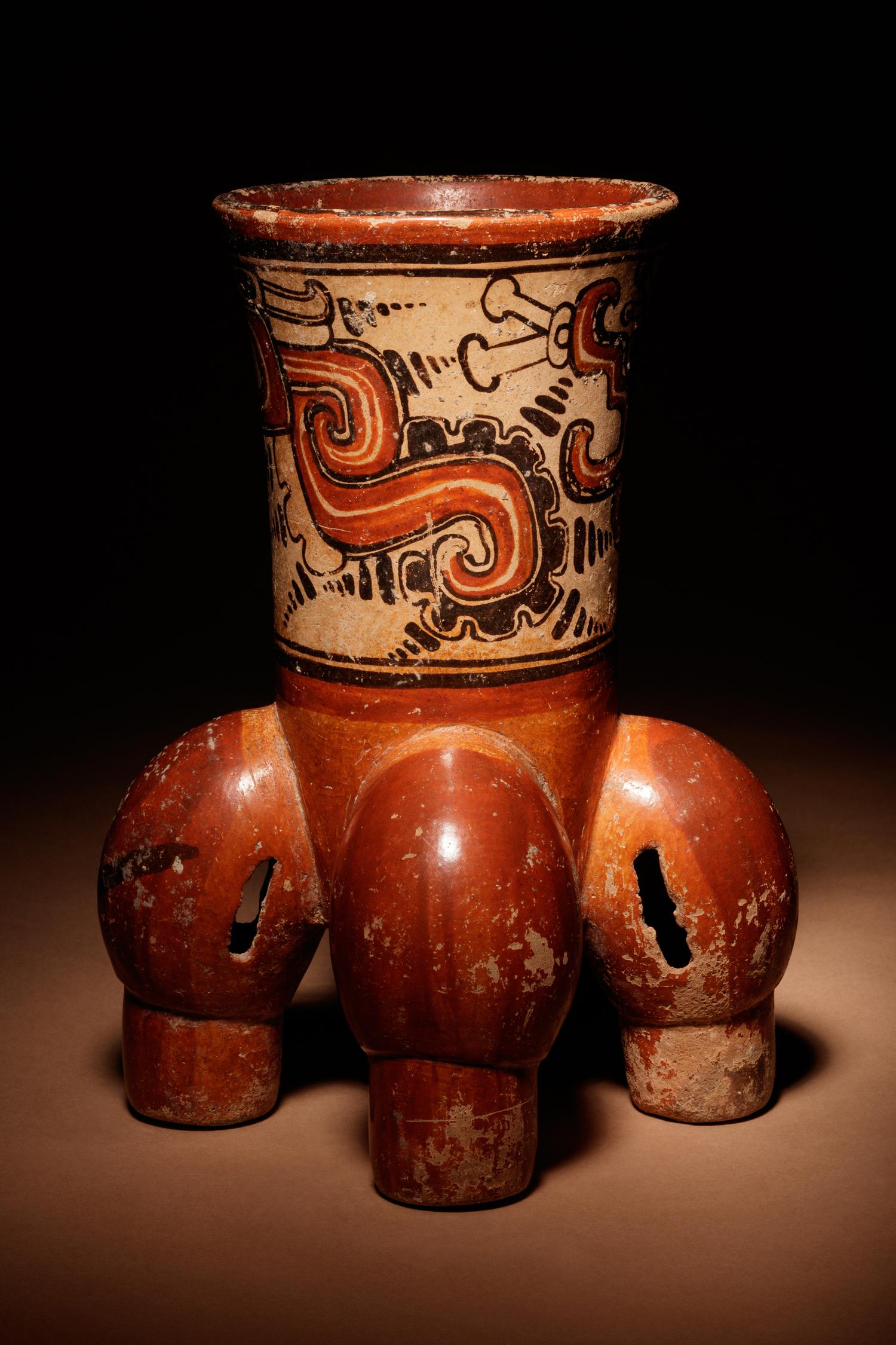 A Maya Polychrome Vessel with Rattle Feet