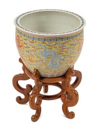 A Chinese Porcelain Jardinière on a Wood Stand