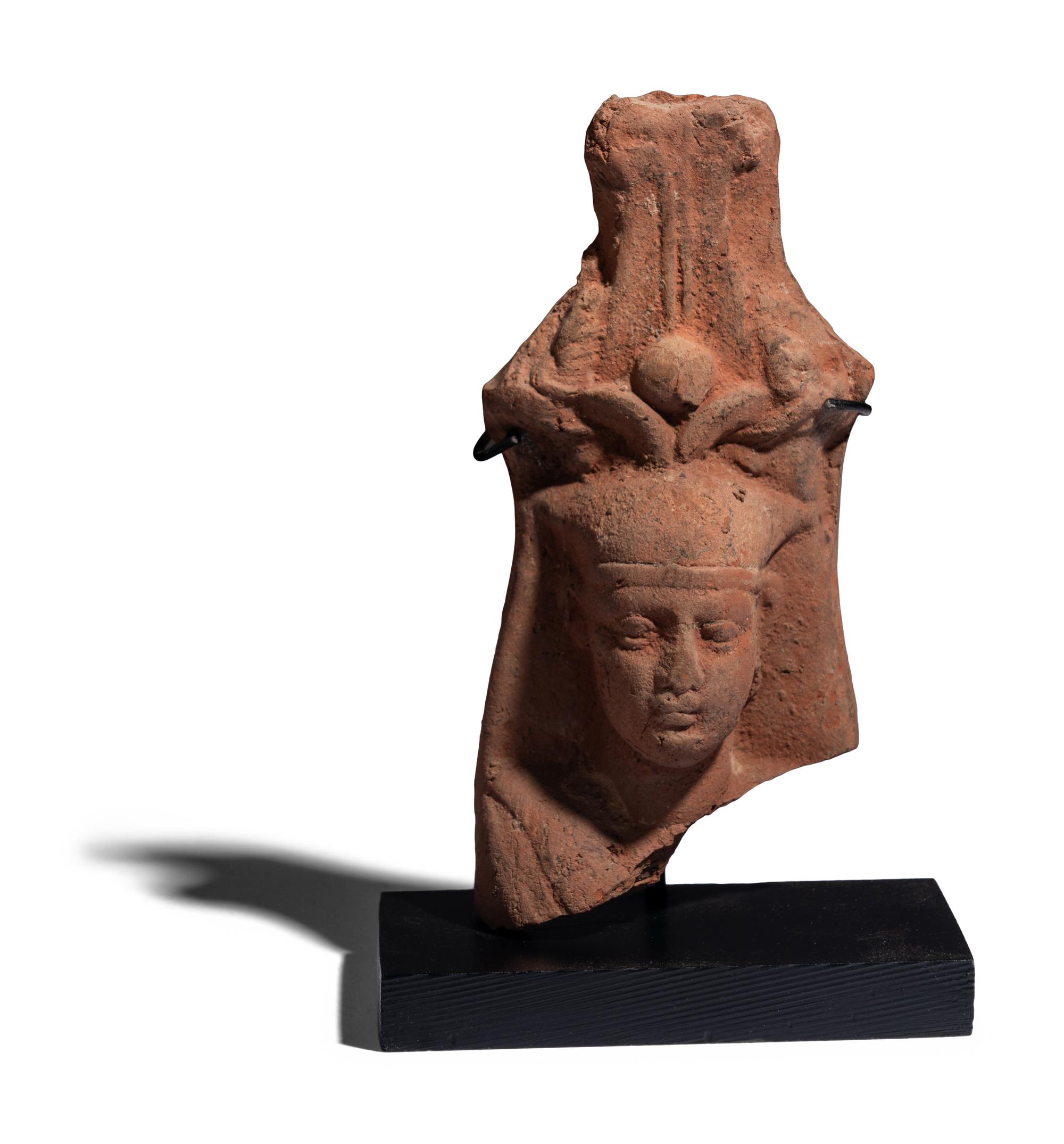 An Egyptian Terracotta Head of the God Osiris