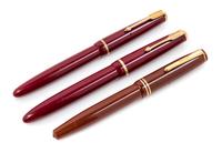 A Group of Three Parker Fountain Pens Length of longest 5 1/2 inches.