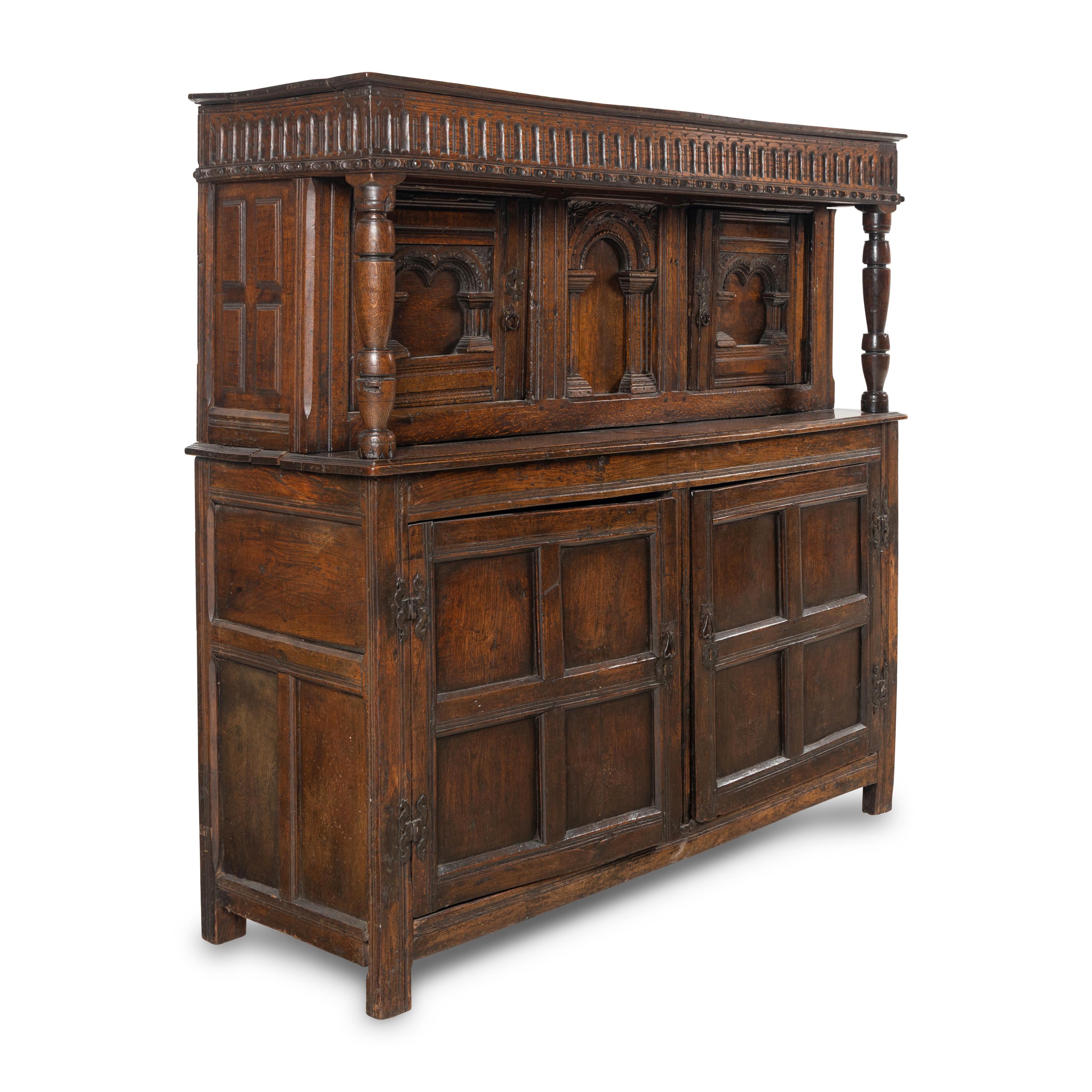 A Jacobean Carved Oak Court Cupboard