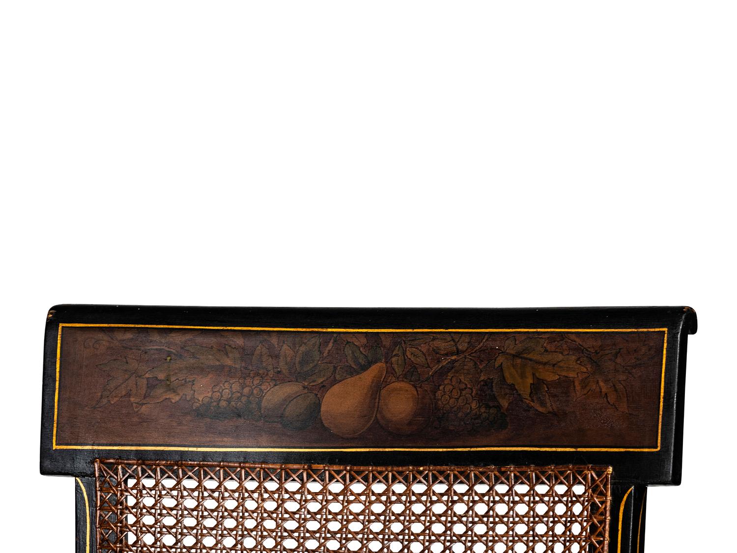 A Classical Carved, Painted and Parcel Gilt Wood Cane Seat Hitchcock Armchair
