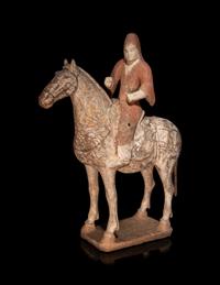 A Pair of Painted Pottery Equestrian Figures