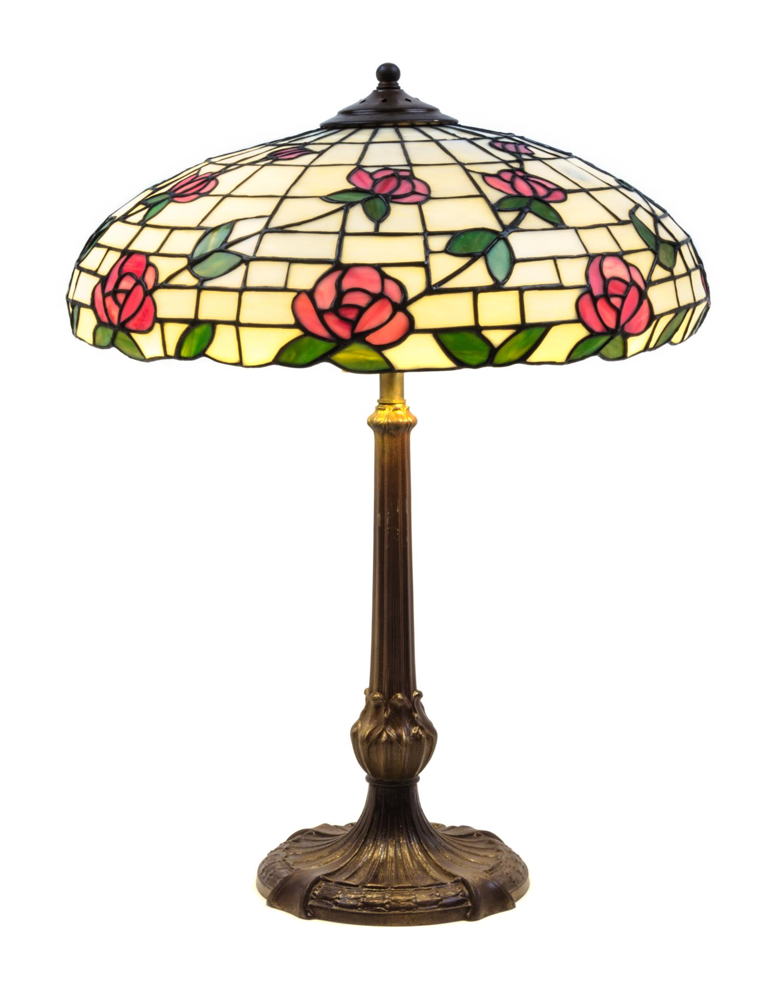 An American Leaded Glass Table Lamp Height 25 x shade diameter 18 inches.