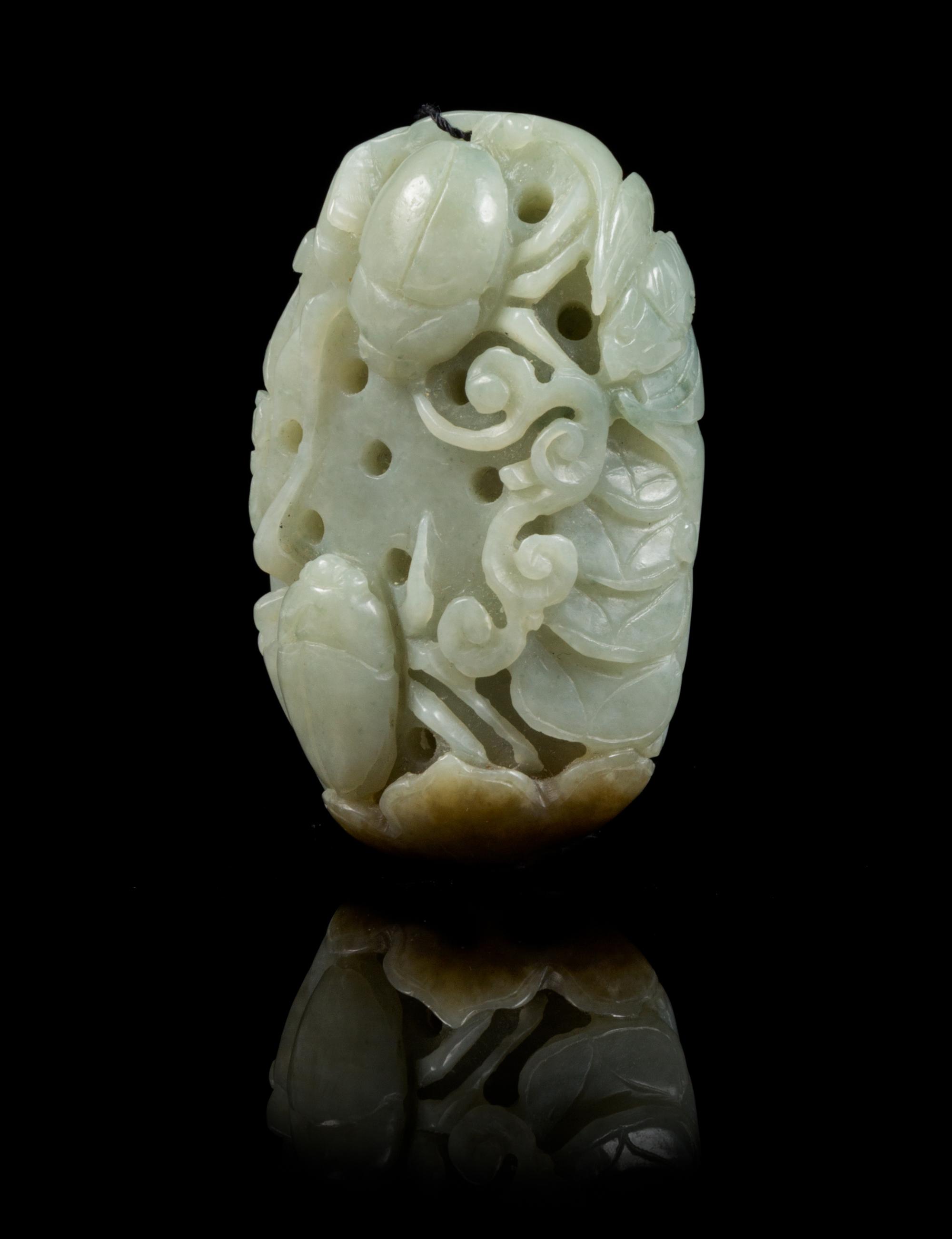 A Carved Jade Toggle Length 2 1/2 inches.