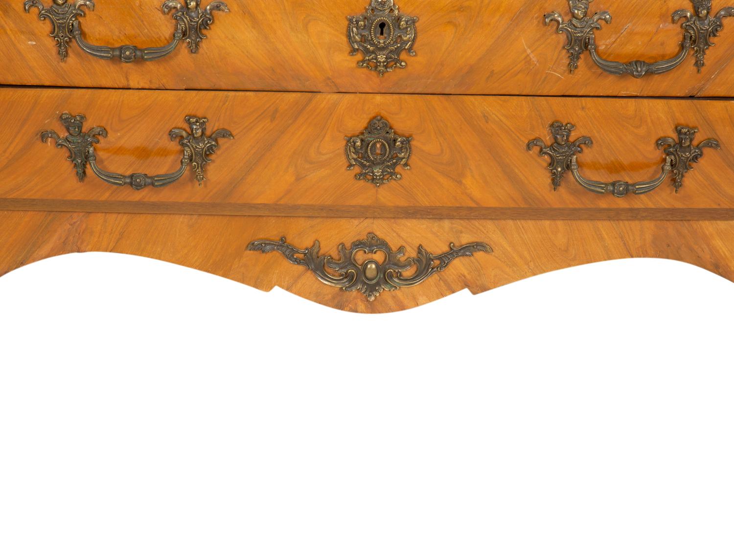 A Régence Style Gilt Metal Mounted Breche d'Alep Marble Top Commode