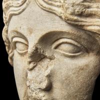 A Roman Marble Fragmentary Head of the Goddess Tyche-Fortuna