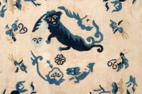 A Chinese Wool Rug with a Buddhistic Lion
