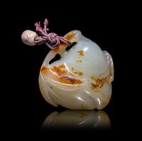 A Chinese Russet and White Jade 'Peach and Bat' Pendant