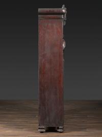 An Aesthetic Movement Crane and Mask Carved Mahogany and Glass Paneled Bookcase