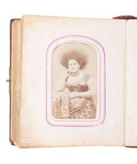 [EARLY PHOTOGRAPHY]. CDV album containing CDV of African American man and Caucasian woman.