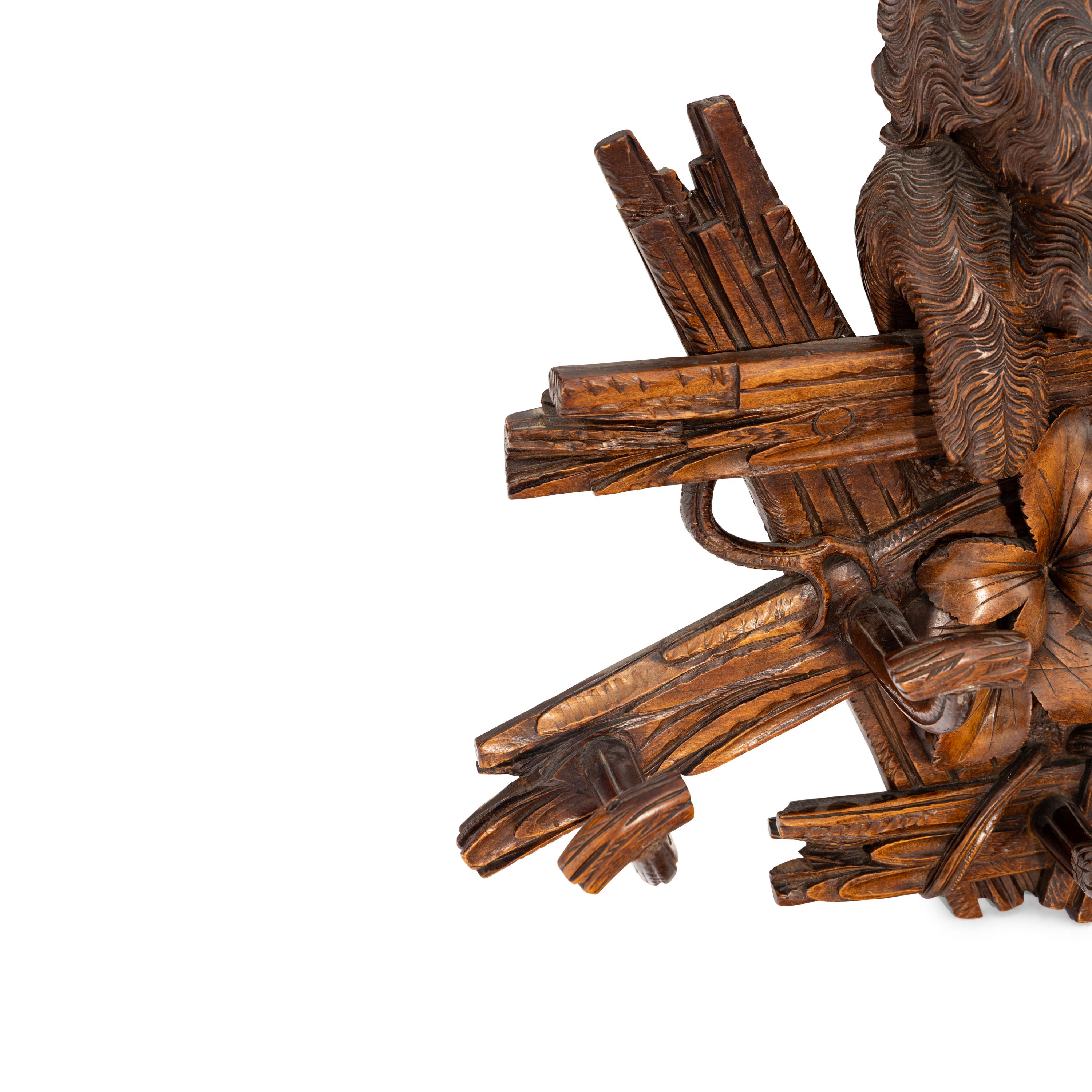 A Swiss "Black Forest" Carved Figural Coat Hook