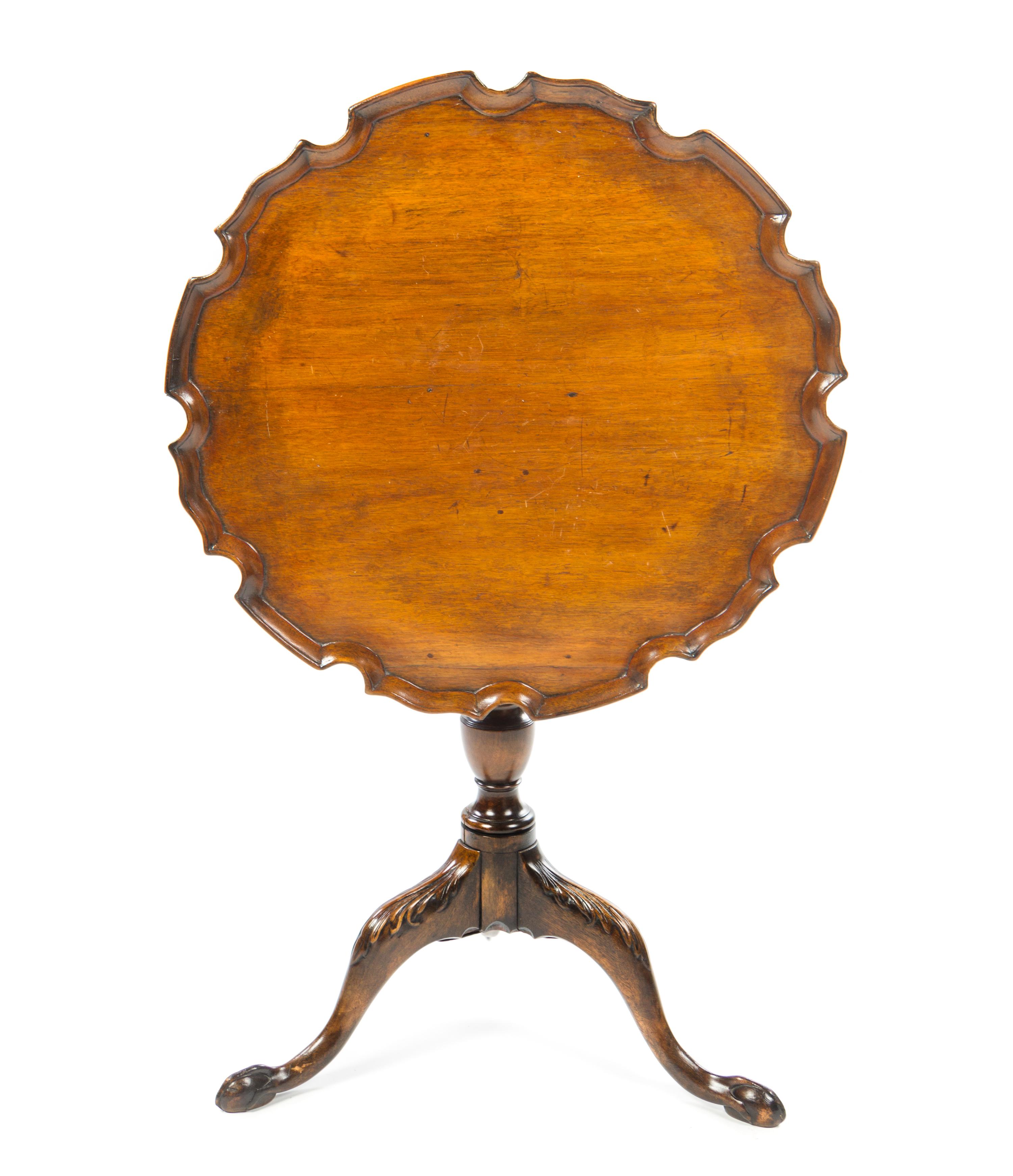 A Chippendale Style Mahogany Tilt-Top Tea Table Height 27 1/2 x diameter of top 26 inches. — 19TH CENTURY