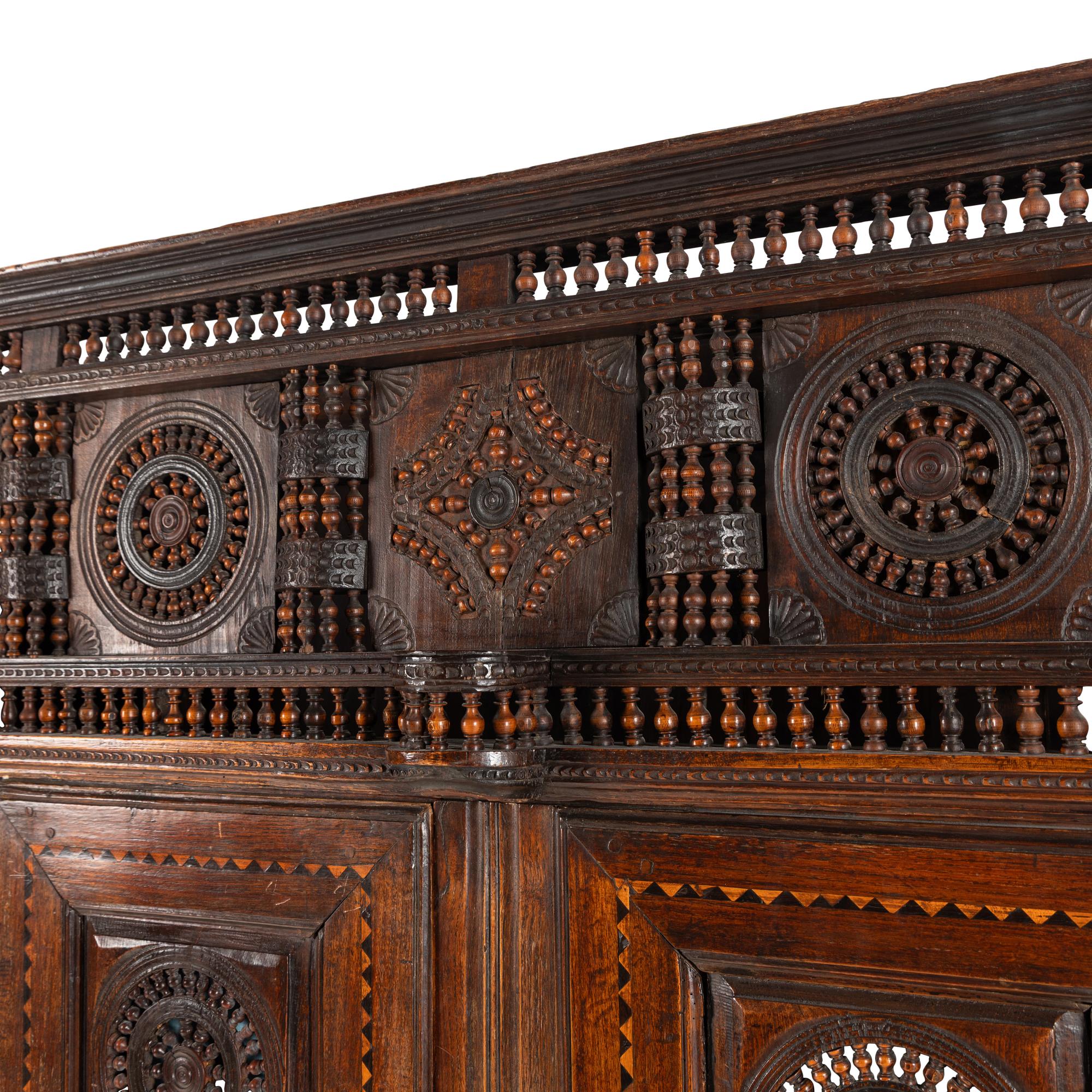 A Breton Carved Walnut Cabinet