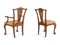 A Set of Seven George III Style Walnut Dining Chairs