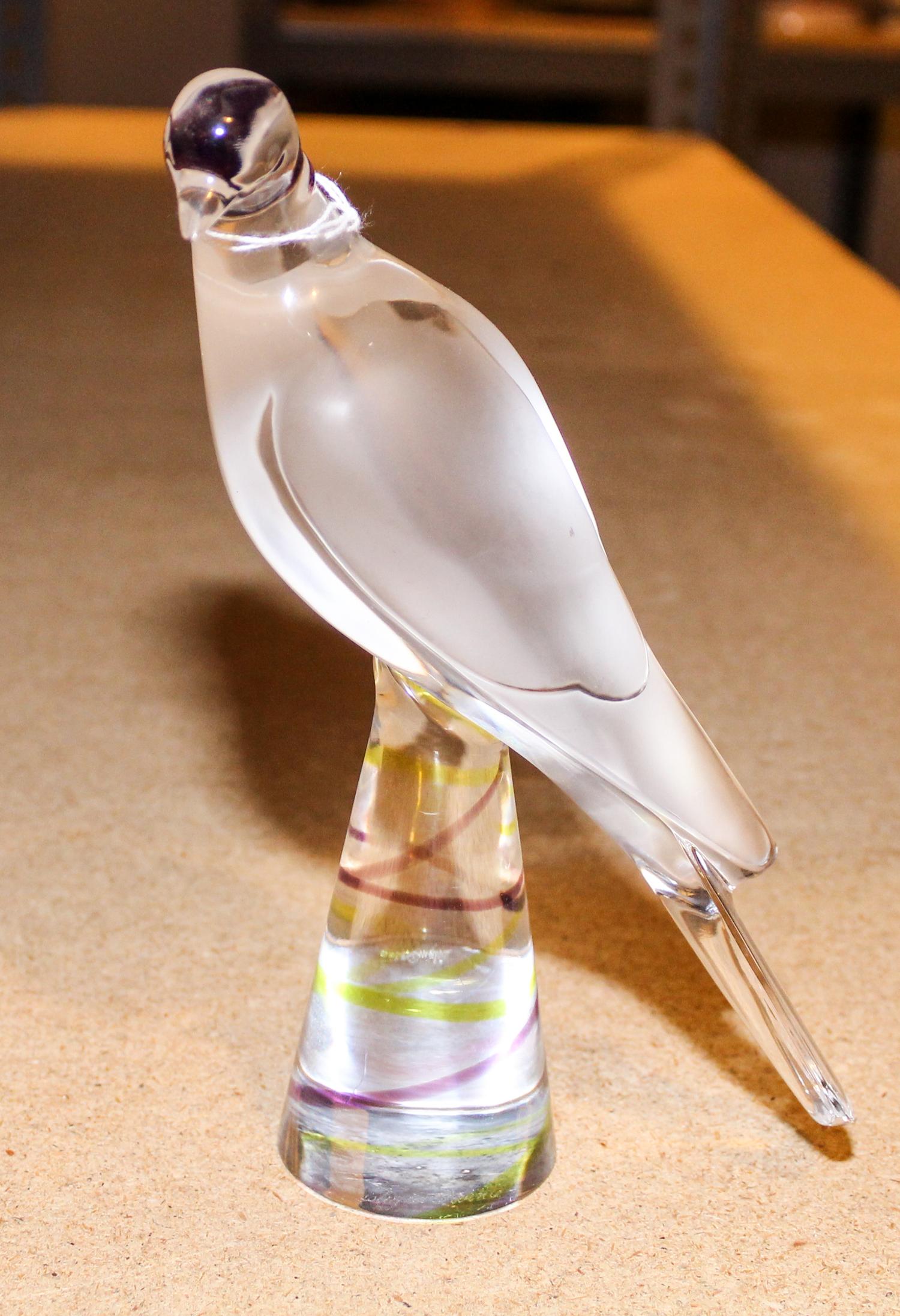 A Lalique Molded and Frosted Glass Bird Figure Height 8 1/4 inches.