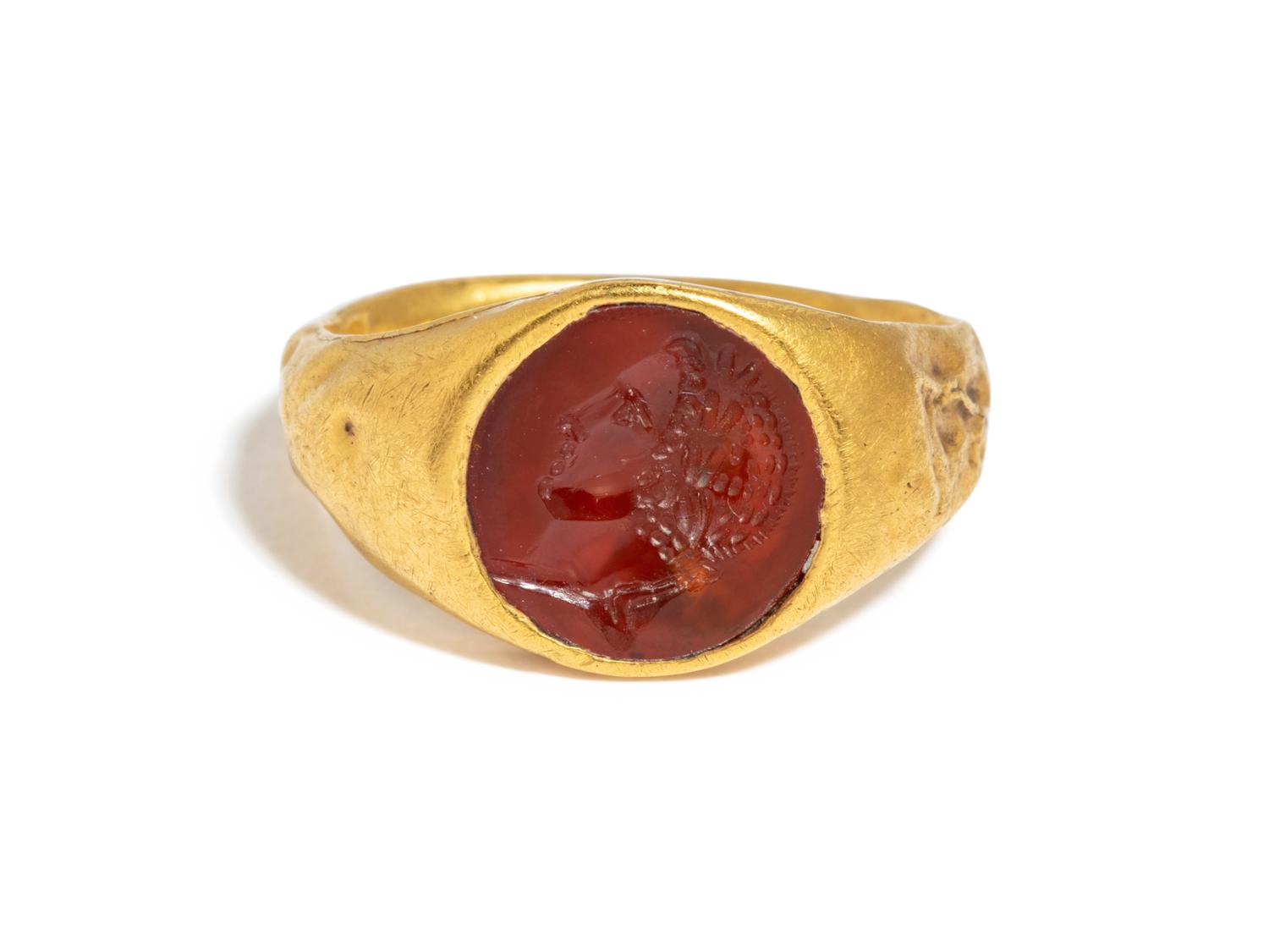 A Roman Gold and Carnelian Finger Ring with the Portrait Head of a Youth, Possibly Phoebus