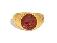 A Roman Gold and Carnelian Finger Ring with the Portrait Head of a Youth, Possibly Phoebus