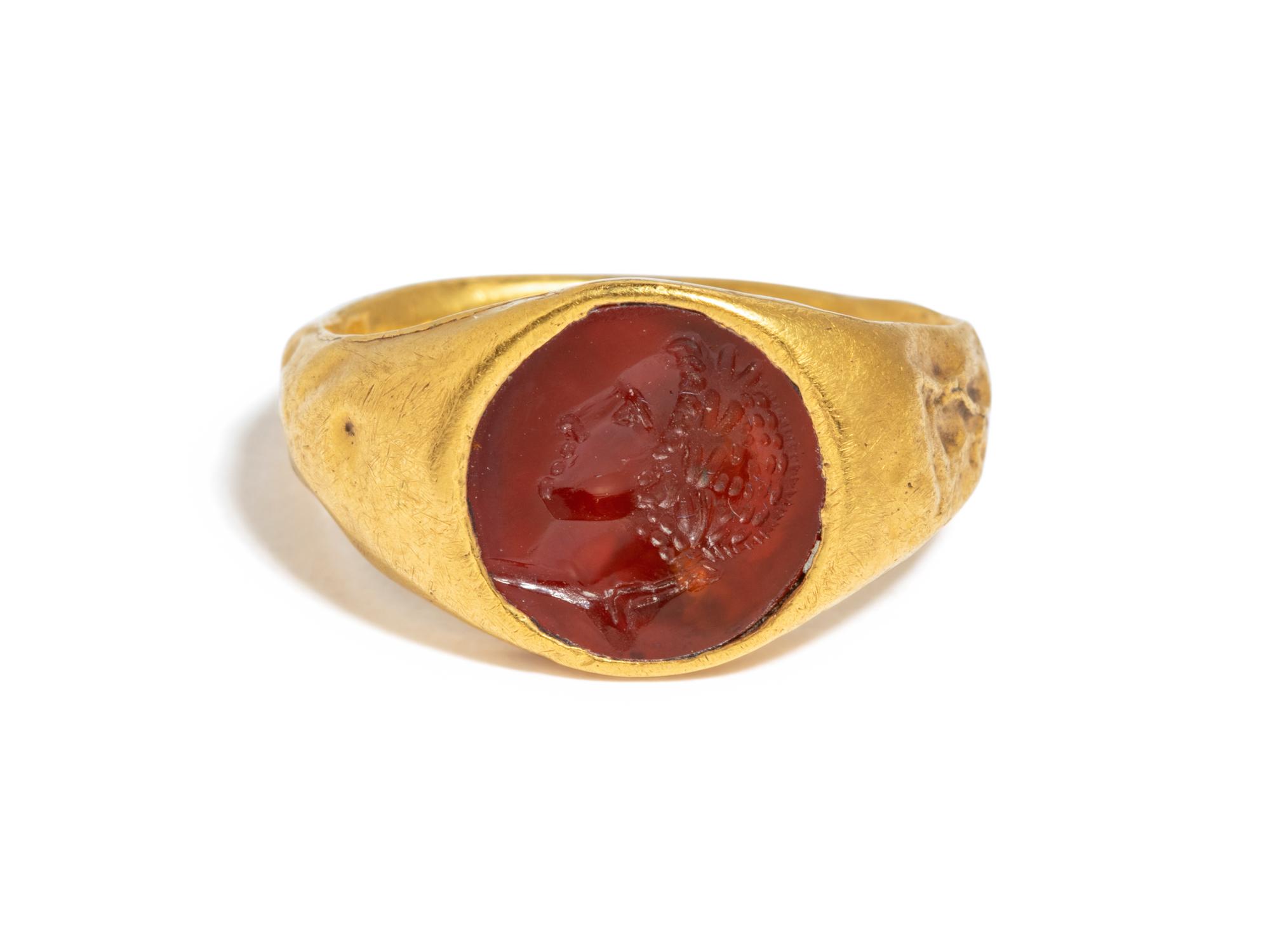 A Roman Gold and Carnelian Finger Ring with the Portrait Head of a Youth, Possibly Phoebus