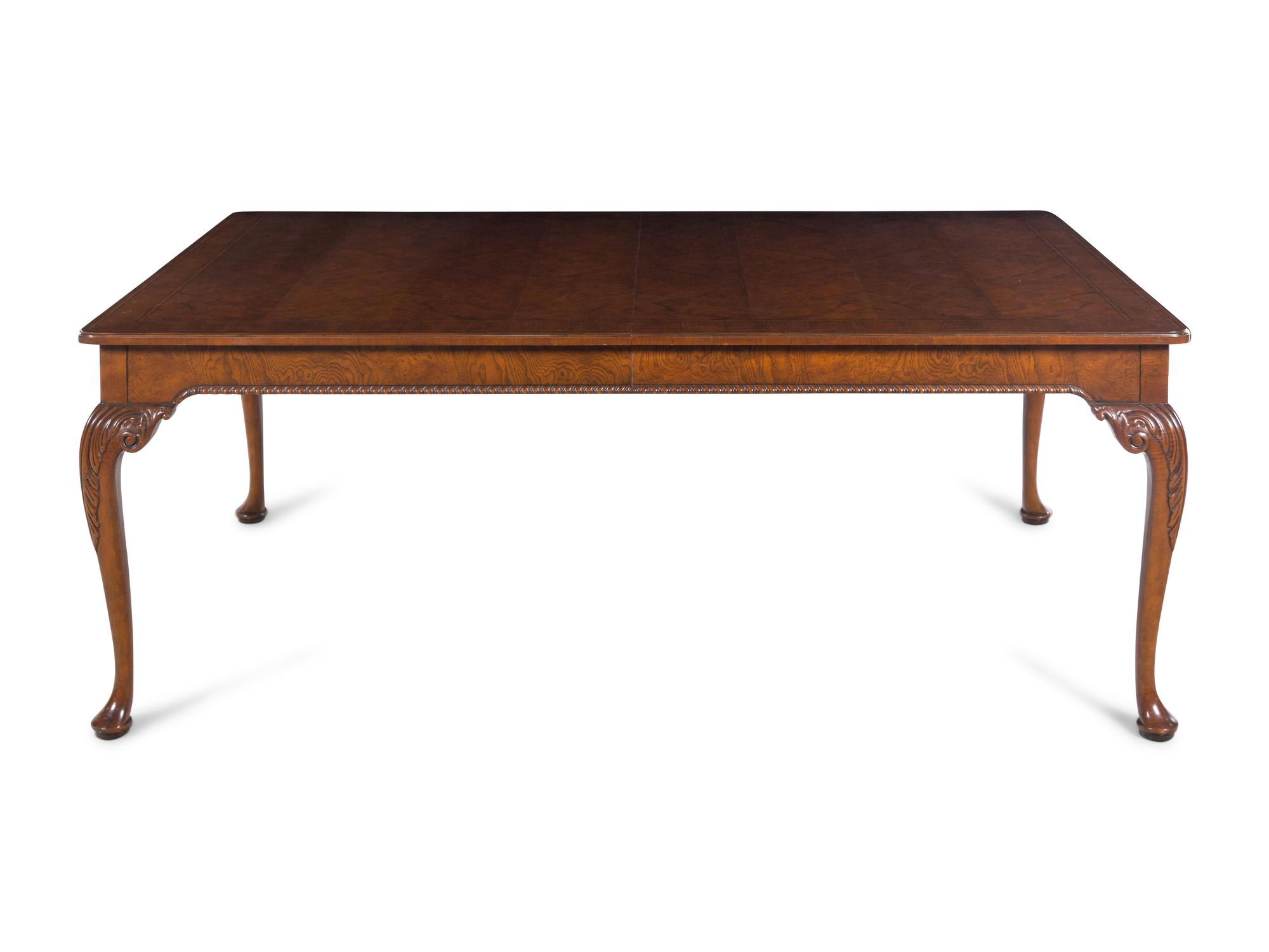 A Baker George II Style Walnut Dining Table
