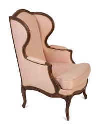 A Louis XV Walnut Bergère à Oreilles — JEAN-NICOLAS BLANCHARD, MID-18TH CENTURY