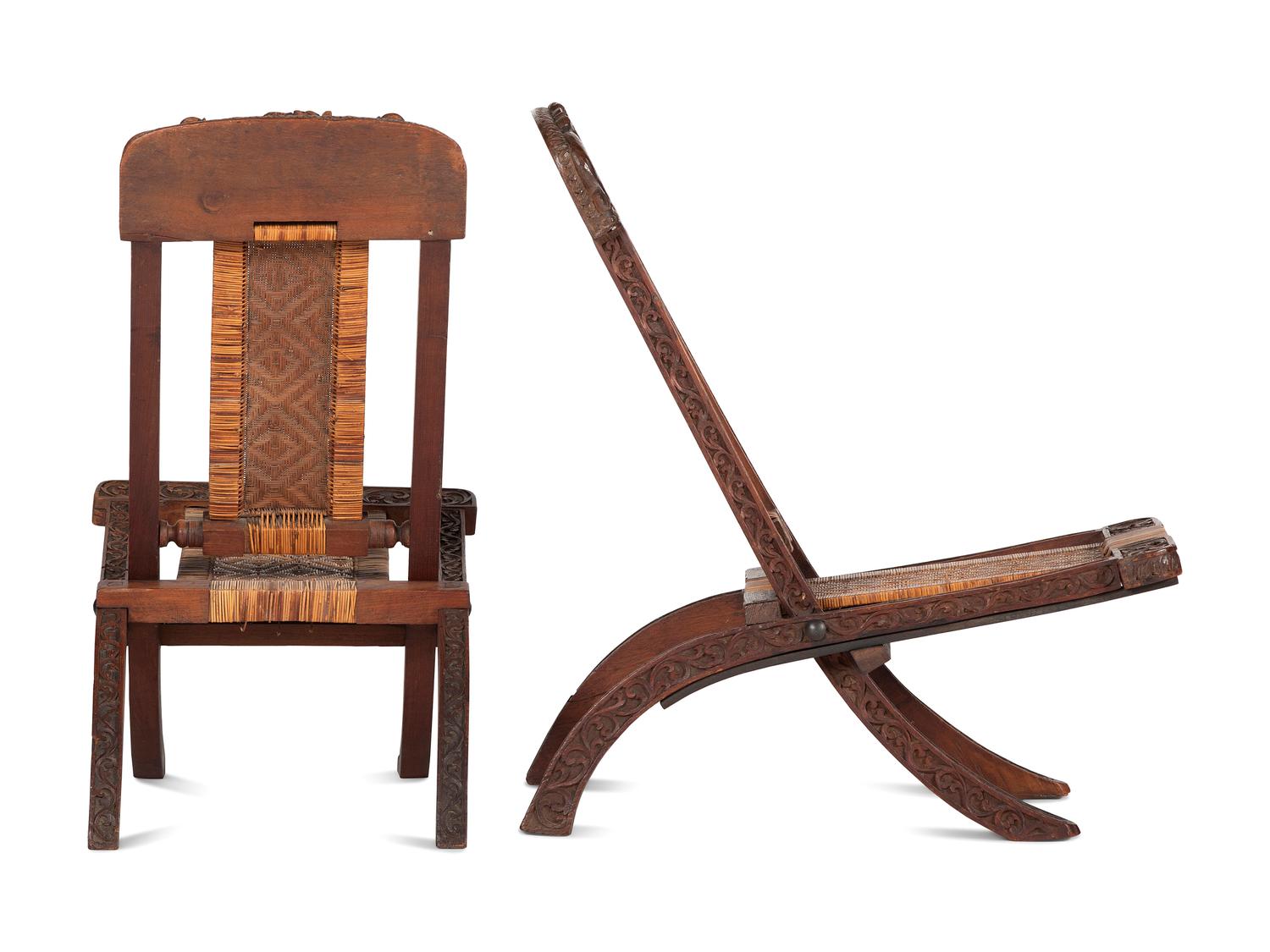 A Pair of Anglo-Indian Elephant-Carved Teak Cane Upholstered Folding Campaign Chairs