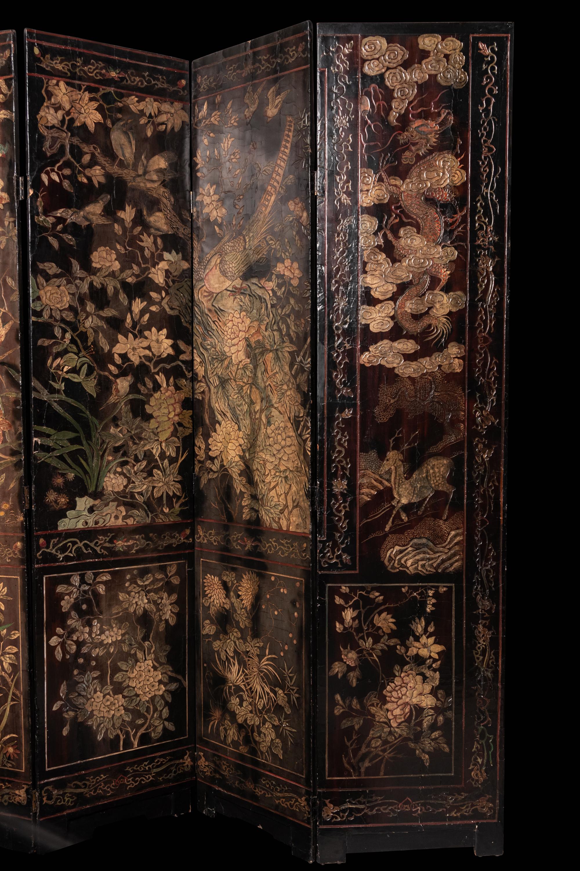 A Coromandel Lacquer Eight-Panel Floor Screen