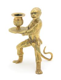 A Brass Monkey-Form Candlestick Height 6 1/2 inches. — 20TH CENTURY