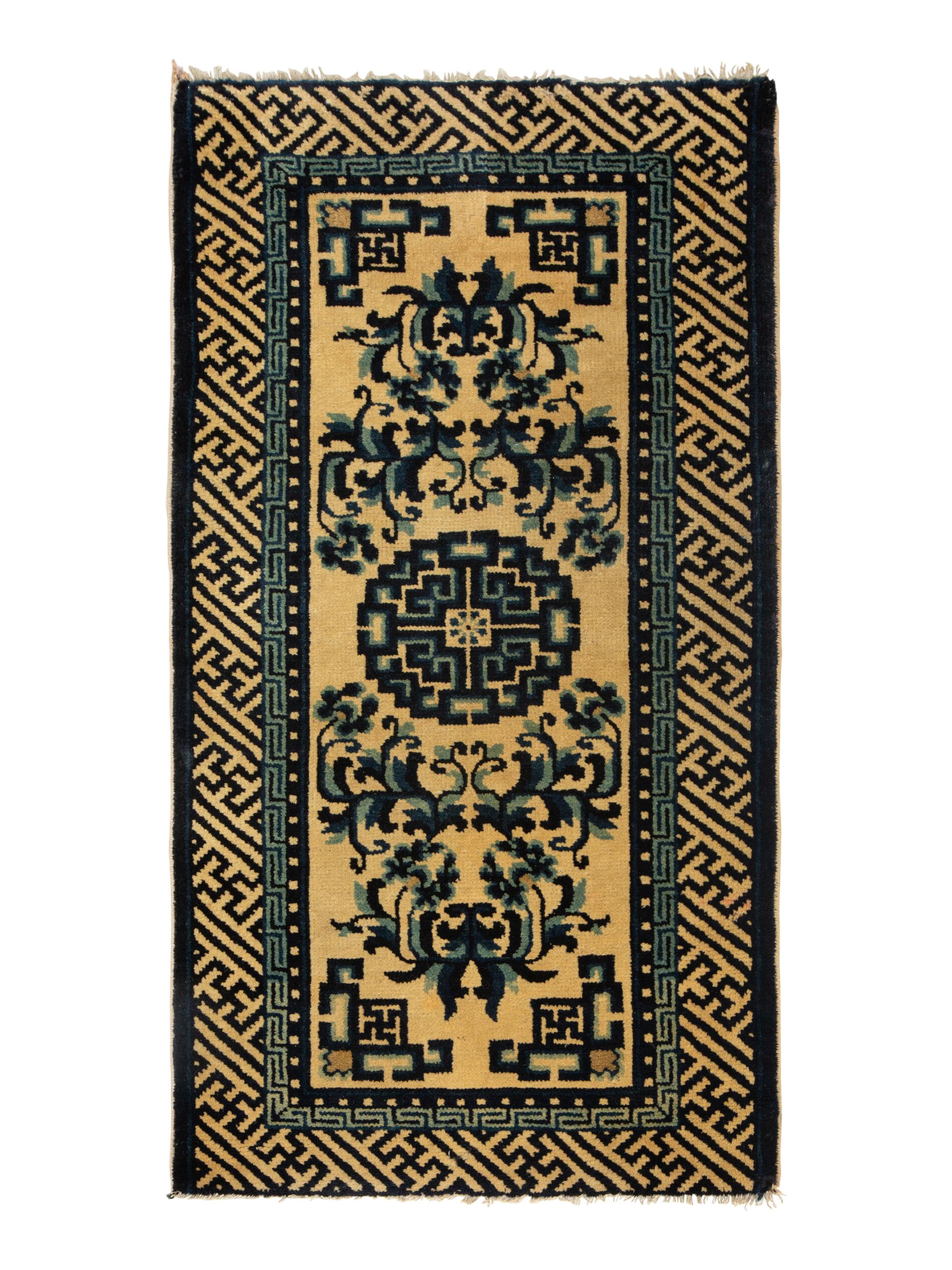 A Group of Four Chinese Rugs