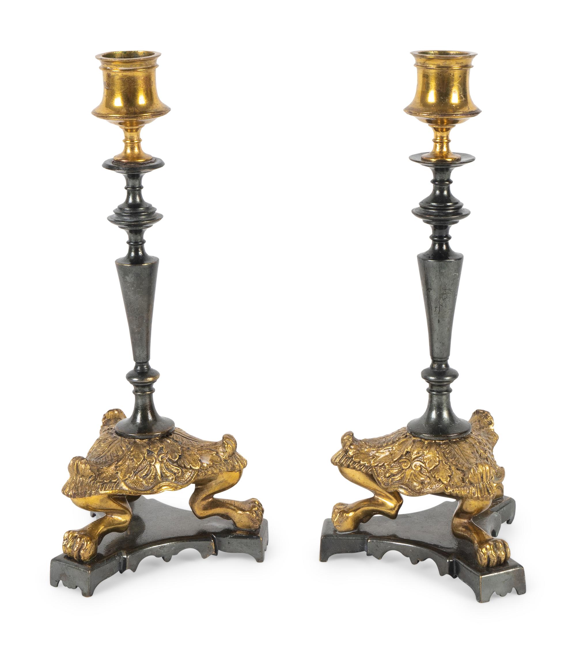A Pair of French Empire Style Brass and Steel Candlesticks