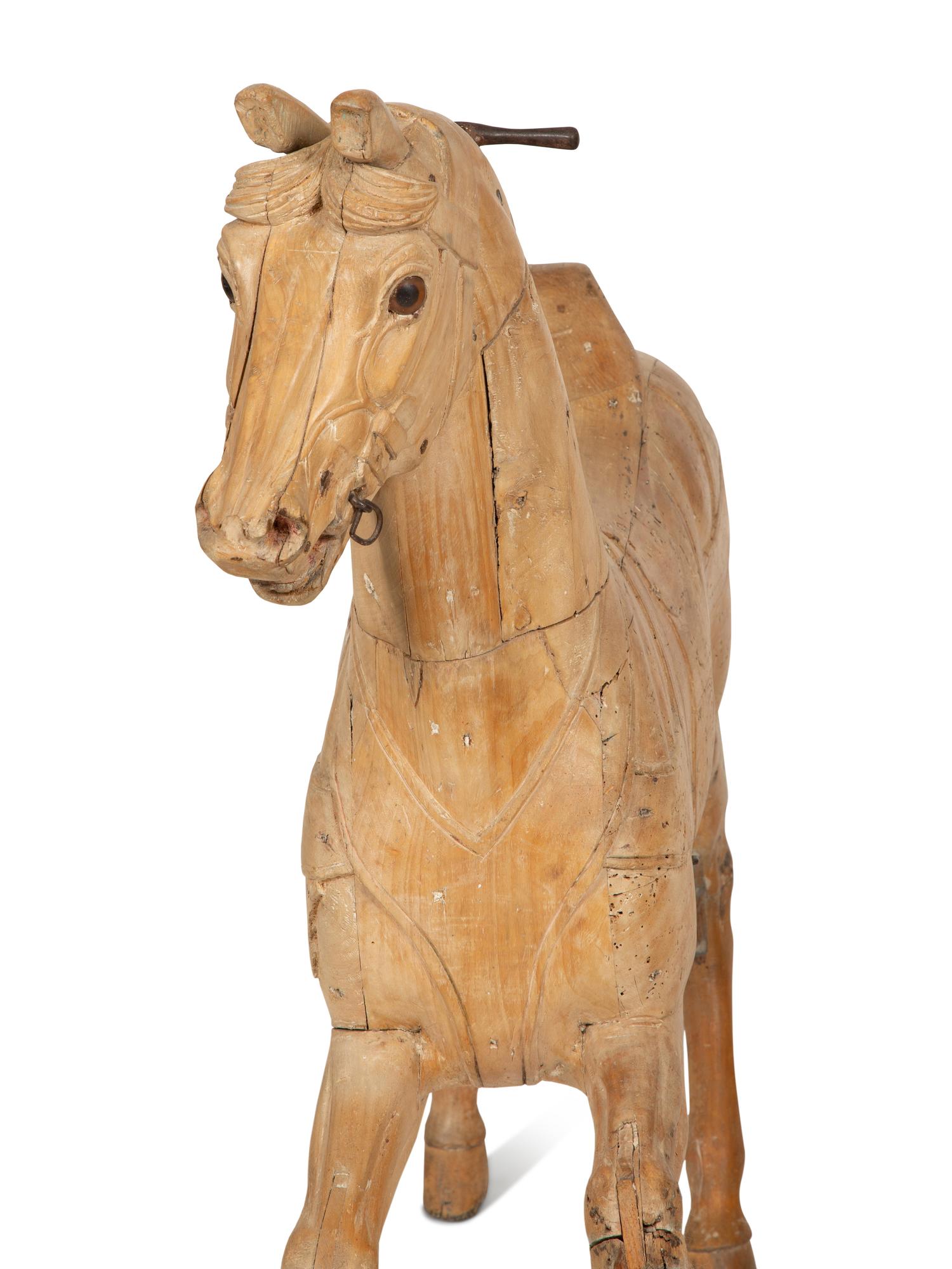 A Pair of Italian Carved Wood Carousel Horses in the Manner of Gustav Dentzel