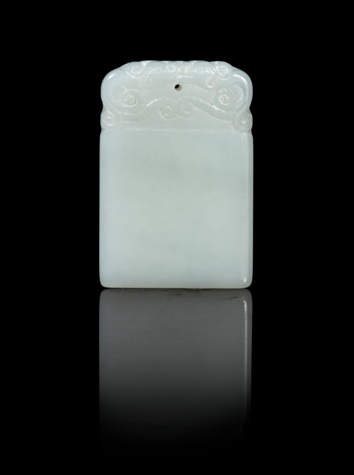 A Carved White Jade Plaque Height 1 3/4 inches.