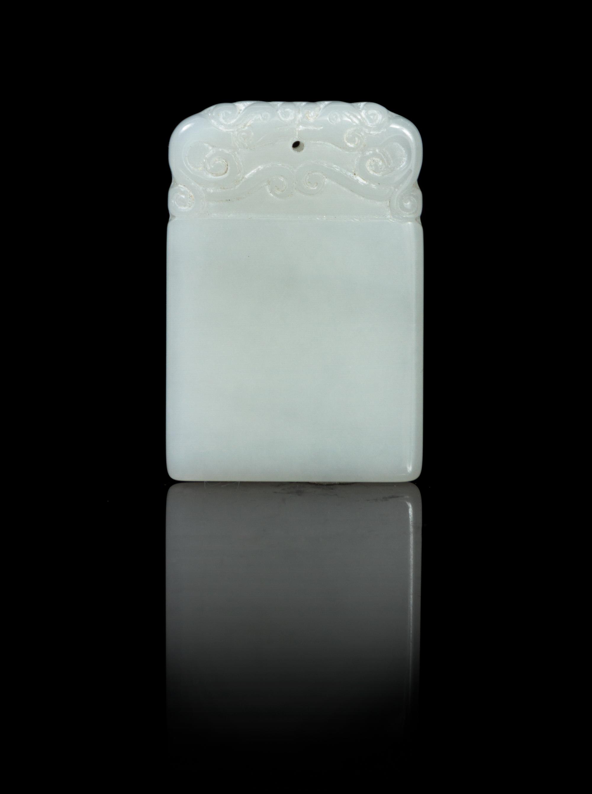 A Carved White Jade Plaque Height 1 3/4 inches.