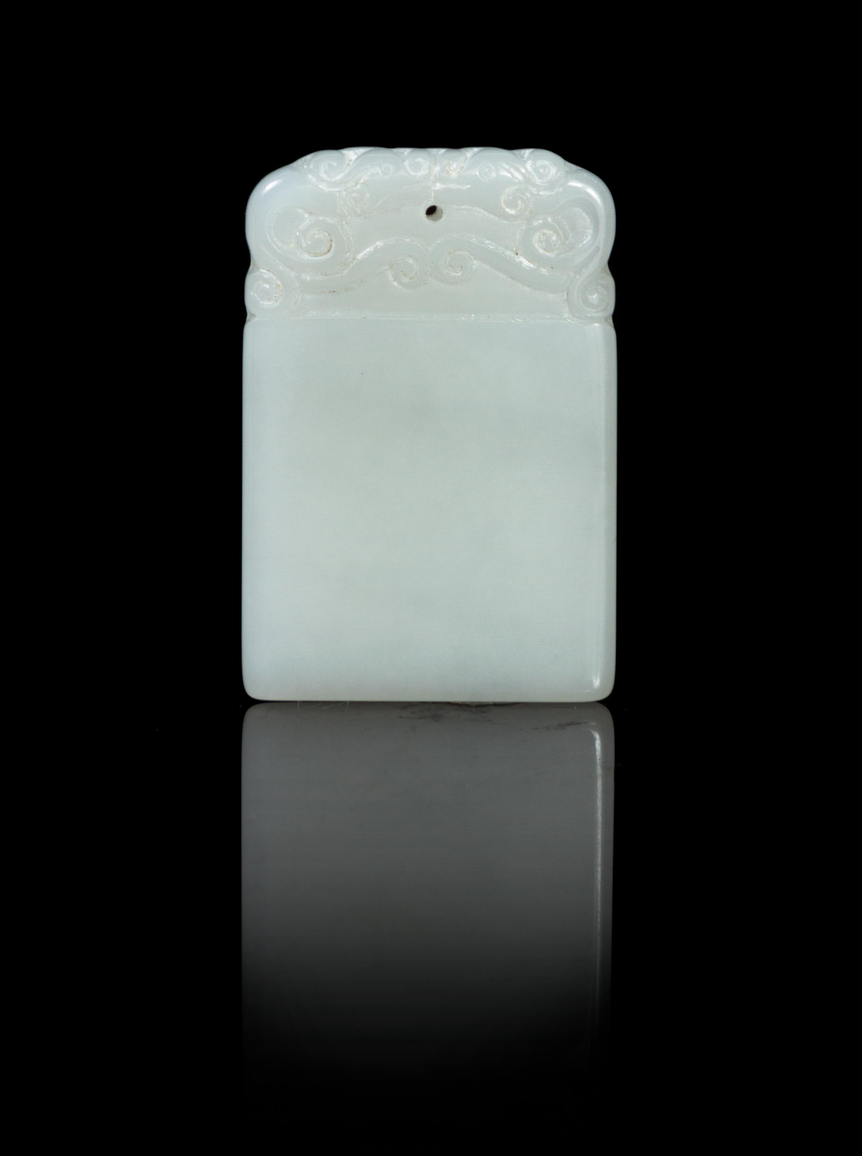 A Carved White Jade Plaque Height 1 3/4 inches.