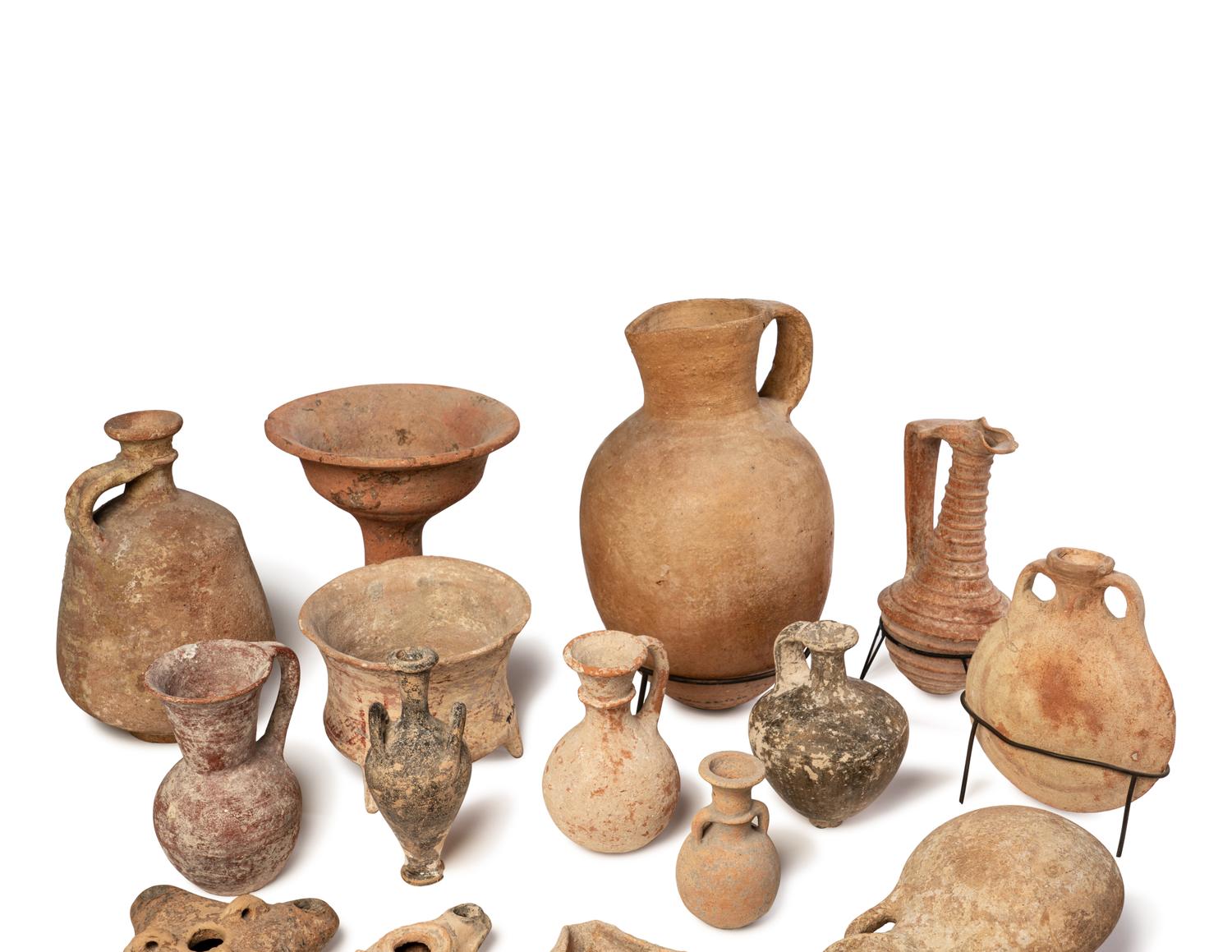 A Group of 19 Holy Land Terracotta Oil Lamps, Pottery, and Bronze Blades